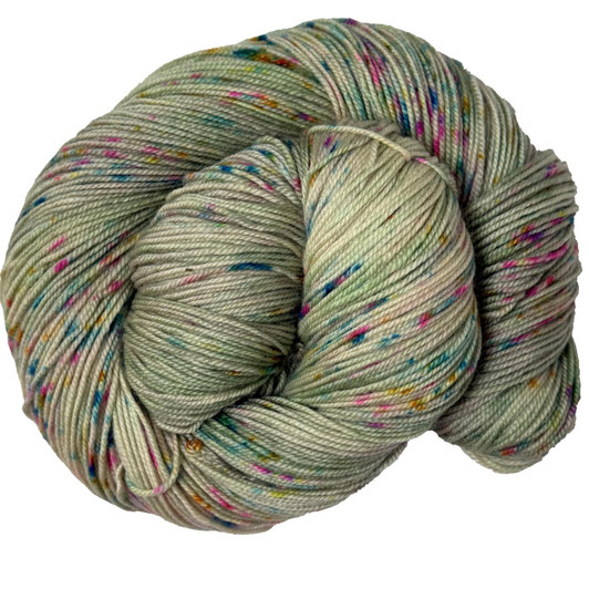 Madcap Mint a sage green variegated sprinkled with bold pink and blue speckles, hand-dyed in Brattleboro, VT.