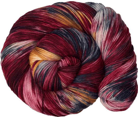 A red variegated colorway, with strikes of navy and gold. Hand-dyed in Vermont.