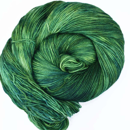 "Foxfire" is the darkest green in this collection, with hints of teal and lighter emerald. Available on your choice of yarn bases. Hand dyed by Wonderland Yarns, made in America.