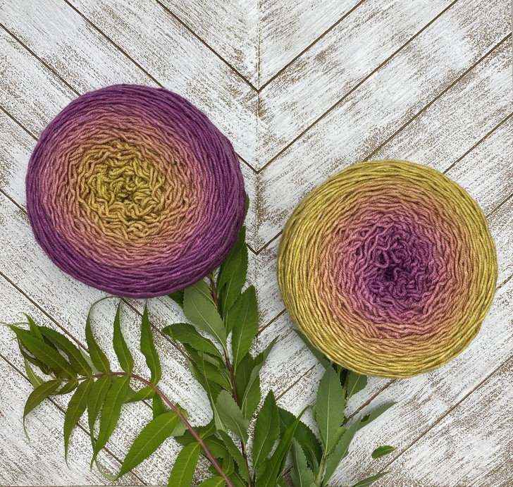 Verbascum is a Blossom gradient cake that starts as a brassy gold and morphs into a rich red-violet. Hand-dyed by Wonderland Yarns on Mad Hatter sport or sock/fingering weight yarn. Made in Vermont.