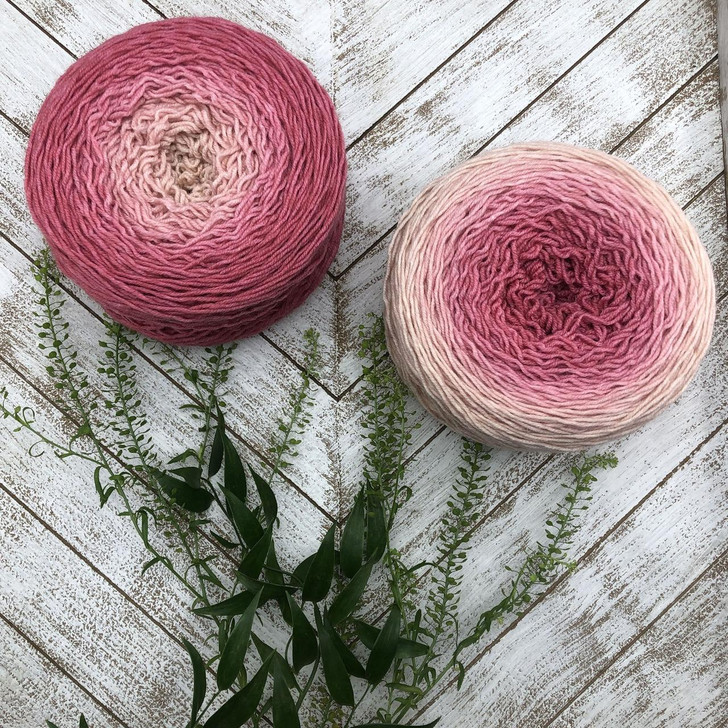 Apple Blossom is a Blossom gradient cake that starts as a peachy-blush and morphs into a glowing coral. Hand-dyed by Wonderland Yarns on Mad Hatter sport or sock/fingering weight yarn. Made in Vermont.
