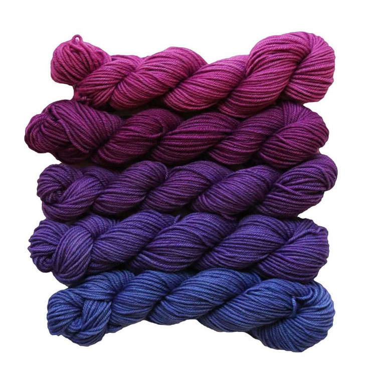 5 Million Kisses is a color morph collection of five mini skeins that transition gradually from a dark magenta to dark blue with purple undertones.