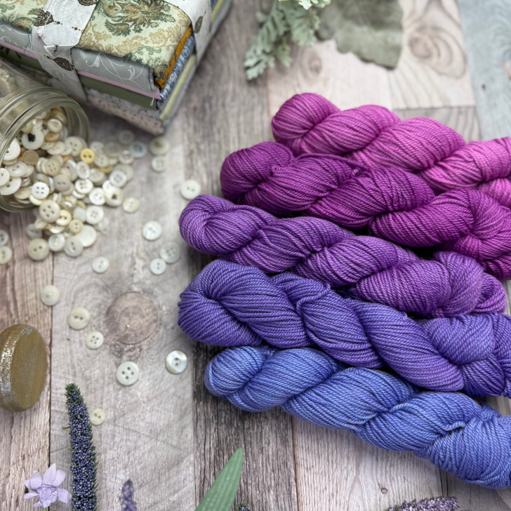 5 Million Kisses is a color morph collection of five mini skeins that transition gradually from a magenta to blue with purple undertones.