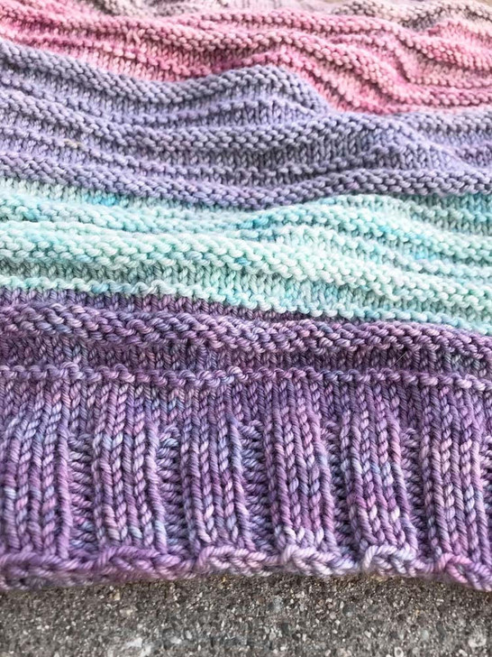 This simple cowl is knit in-the-round with our hand-dyed mini skeins.  Free knitting pattern download.