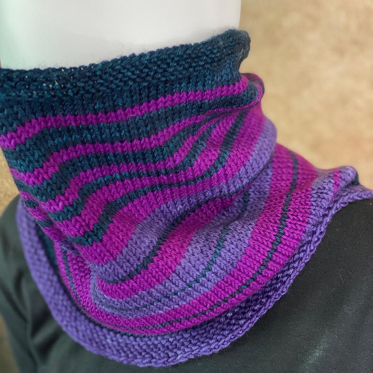 Need and instant gratification project? Layer stripe upon sweet stripe in this simple cowl-in-the-round. This kit contains three Mad Hatter sport weight mini skeins and a pattern to knit a striped cowl.