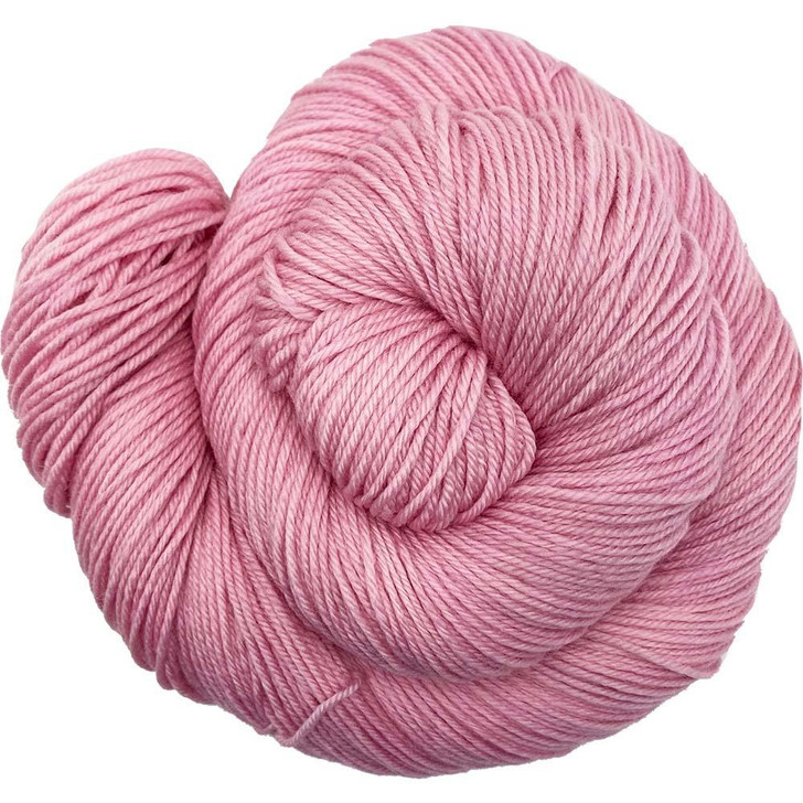 Handsome Pig is a perfect blush-pink tone. Hand-dyed on our Mad Hatter sport base by Wonderland Yarns in Vermont. This colorway is also available on a variety of yarn bases.