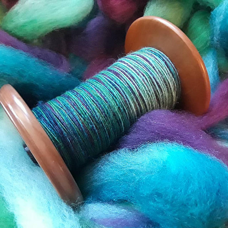 This is classic 100% Merino fiber, 21-micron. A favorite of spinners and felters, alike, this fiber is extra super-soft with a delicate crimp that gives it a springy texture. We take care in our dyeing process to retain loft and ease of drafting. Wonderland Yarns & Frabjous Fibers handle the wool top with care to ensure it is lofty and easily drafted. Available on a variety of colorways and weights. Made in Vermont.