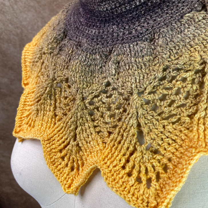 The Autumn Harvest Collar utilizes crochet front and back post stitches which give it a cozy fullness and plenty of textured elements to keep it interesting. One gradient Blossom on Mary Ann sock/fingering weight will be enough to make this lovely garment.