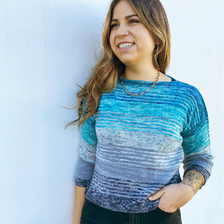 This beginner-friendly sweater features a slightly cropped, box-top fit with dropped shoulders, rolled boatneck, and loose three-quarter sleeves. Sleeve and body length are easily altered for an ideal fit. This pattern includes instructions for both top-down and bottom-up knitting. Knitting from the top-down allows you to try the sweater on as you go and knit a custom fit.