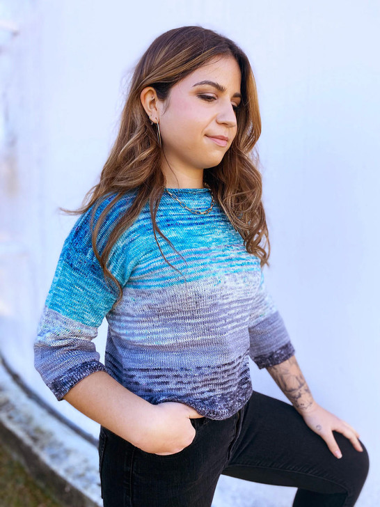 This beginner-friendly sweater features a slightly cropped, box-top fit with dropped shoulders, rolled boatneck, and loose three-quarter sleeves. Sleeve and body length are easily altered for an ideal fit. This pattern includes instructions for both top-down and bottom-up knitting. Knitting from the top-down allows you to try the sweater on as you go and knit a custom fit.