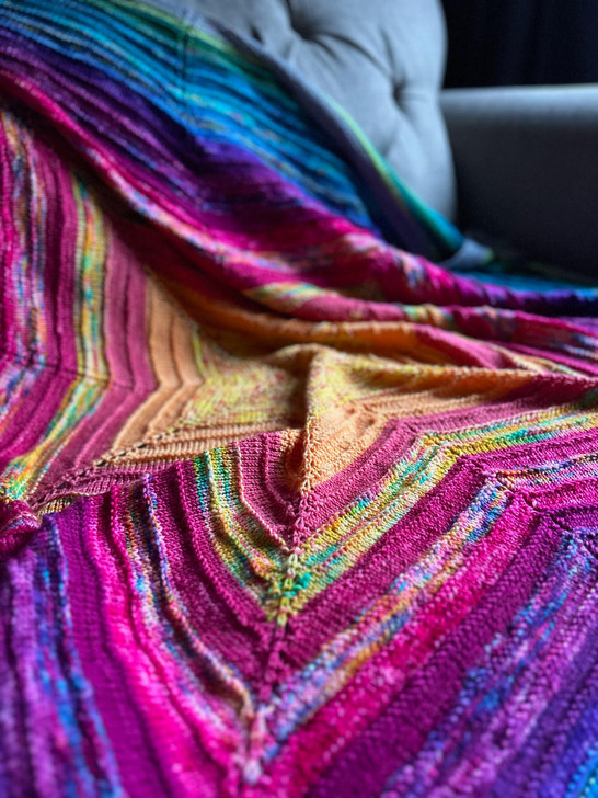 A rainbow of colors and myriad of dye techniques knit into this beautiful blanket.