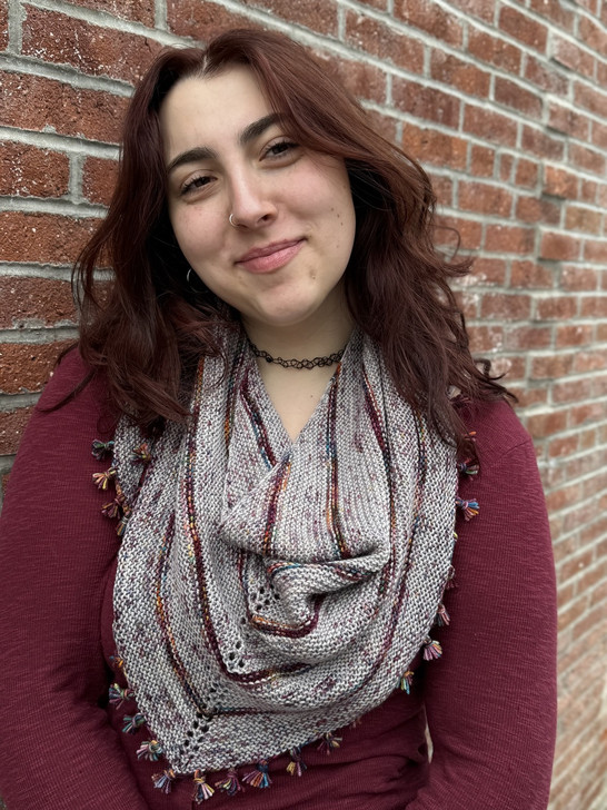 On the Fringe alternates colors to create a triangle shawl that leaves some room to make a cute fringe border.