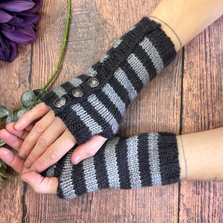 These easy-breezy striped 'Howl at the Moon' mitts from Wonderland Yarns are perfect for that haunted corn maze run planned for this fall! Each kit comes on our Lory DK weight 1 oz mini skeins, 2 of one color, and one of another for contrast — oh and buttons too!