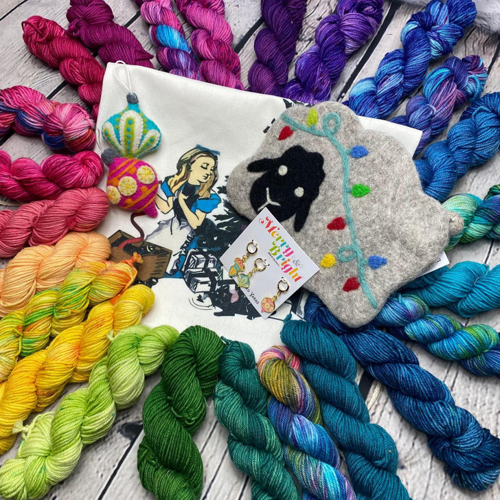The 2023 yarn advent from Wonderland Yarns had included bold and vibrant colorways to construct a star-shaped blanket. Colors remain a mystery until after they have been opened!