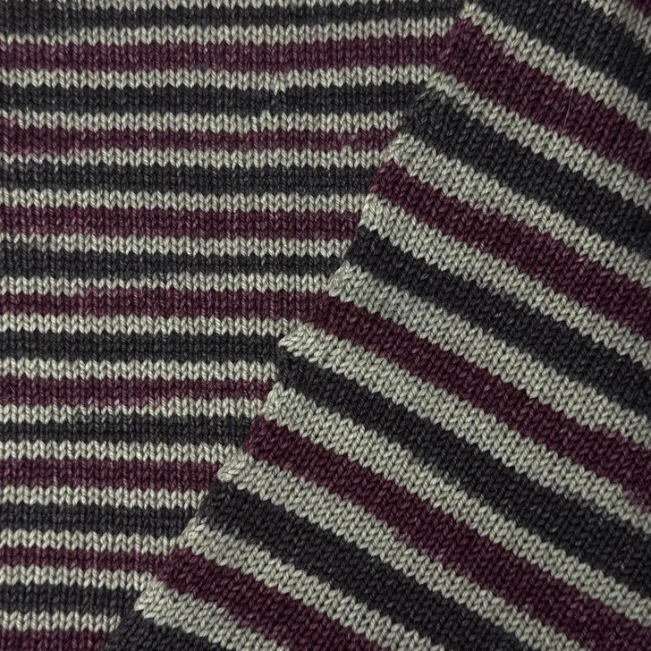 #6 Life is Like a Box of Chocolates is self-striping sock yarn with stripes of creamy beige, dark chocolate brown, and rich maroon