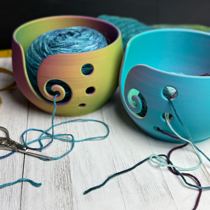 The graceful spiral opening guides your working yarn smoothly while the roomy bowl keeps your skein or cake right where it belongs.
