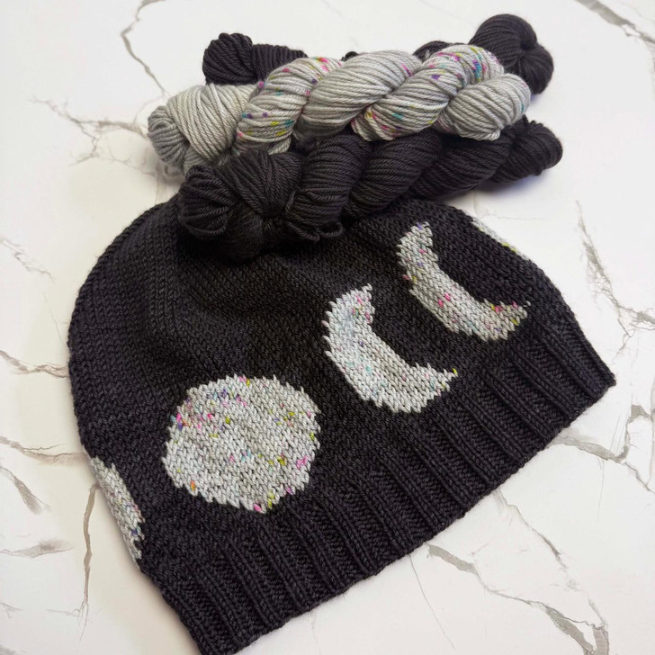 Get your Merlin vibe on in a flash with this quick colorwork hat by Wonderland Yarns that features the phases of the moon! This grab-and-go hat kit uses 3 mini skeins of hand-dyed Mad Hatter sport weight yarn and comes in a slouchy or fitted style.