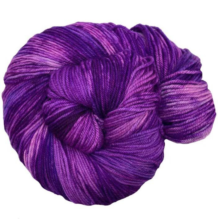 A bold, dark magenta with hints of purples and blues, is available on your choice of yarn bases. Hand dyed by Wonderland Yarns, made in America.