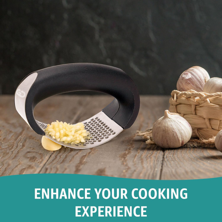 Garlic press rocker, crusher, mincer tool stainless steel with a Garlic Peeler, spatula, and Brush extract more Garlic Paste. The Garlic Mincer Tool