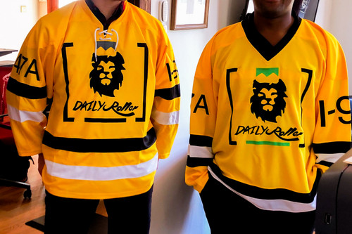 Daily Roller i-70 Hockey Jerseys model by two humans in an office setting. Front