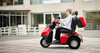 Afikim Afiscooter S3 3-Wheel Scooter, red, lifestyle, rider outside a building