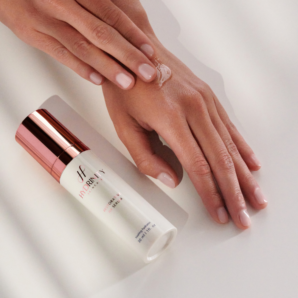 Hydrinity Restorative HA Serum Being Applied to Hands to Show Texture