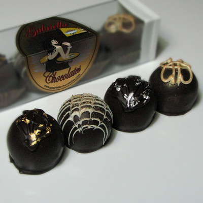 Our Spirited Dessert Truffle Collection will give you all the inspiration you need to kick off your evening right! Imbibe on top-shelf liquors that have been generously paired with 60% Dark Chocolate, creamy mousse flavors and sublimely complimentary centers. No glass required; although, that would be a cute way to serve them.