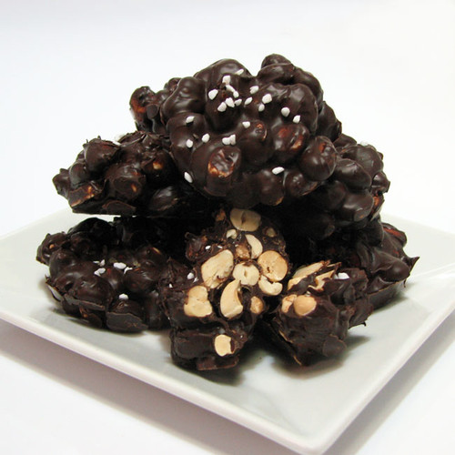 Dark Chocolate Peanut Clusters:
Fresh roasted peanuts, lightly salted with sea salt & 60% Dark Chocolate with a sprinkle of sugar pearls and Hawaiian bamboo jade sea salt .