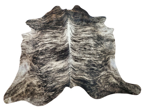 This large dark brindle cowhide rug will stun your space, the exotic grey with white spine will blend into any room and create inspiration. 
