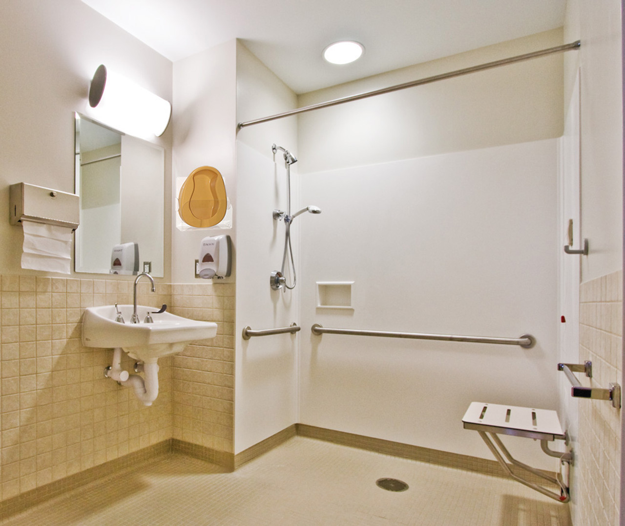 Acrylic bedpan storage rack mounted in bathroom