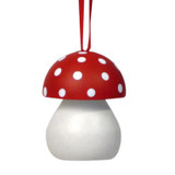 Red and white wooden toadstool ornament hanging by a red ribbon against a white background.