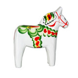 White wooden Dala horse figurine with traditional green, red, and yellow kurbits floral painted decorations.
