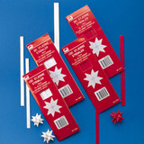 White paper star strips in red packaging, with some finished white stars.
