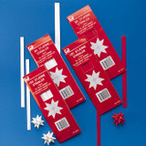 Red and white Pobra paper star kits with pre-cut strips and finished stars.
