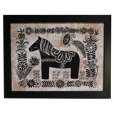 Black framed wall hanging with a black and white Dala horse batik print.
