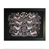 Framed wall art with a white tree design and birds on a black background.
