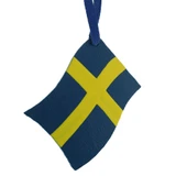 Hand-painted wooden Swedish flag ornament with blue and yellow design and hanging ribbon.