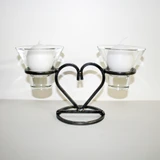 Talla Imports Danish iron heart candleholder with glass cups holding two white ball candles.