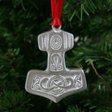 Lead-free pewter Thor's hammer ornament with intricate Norse engravings hanging by a red ribbon.