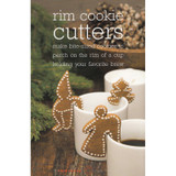 Gingerbread cookies shaped like an angel, gnome, and tree perched on white mugs.
