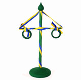Green wooden Midsummer pole with blue and yellow ribbons, green rings, and a round base.