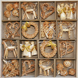 Boxed assortment of straw ornaments: angels, hearts, wreaths, goats, balls, and pine cones. Natural wheat straw.