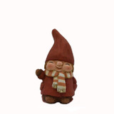 Small ceramic red tomte figure with striped scarf waving against a white background.