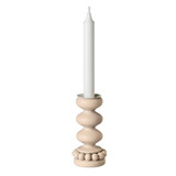Aarikka Linna natural wood candle holder with spherical design, holding a white taper candle.