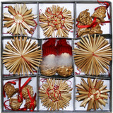 Straw ornaments and two tomte figures in a divided box
