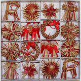 Boxed assortment of 16 straw Christmas ornaments: angels, stars, snowflakes, and goats in red and gold.