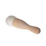 Iris Hantverk kabuki makeup brush with birch handle and white goat hair bristles.
