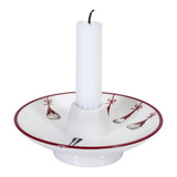 White ceramic candleholder with red trim and gnome illustrations, holding a white candle.