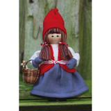 Handmade Swedish doll in traditional red hat, vest, blue skirt, holding a small basket.