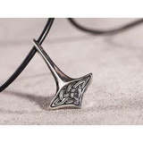 Silver Thor's Hammer pendant on a black rubber chain, Celtic knot design, angled view, pewter.